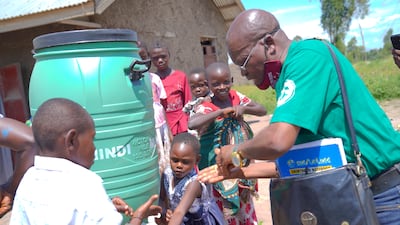 Villagers wash their hands as a preventive measure against Ebola after attending a church service in Rwampara, Ituri, in DR Congo. EPA
