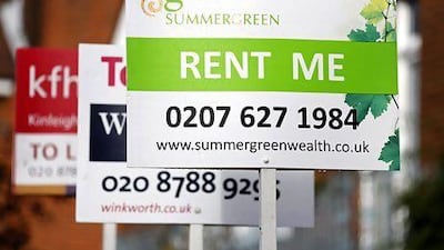 Signs advertising properties for rent in Roehampton, London. Simon Dawson / Bloomberg News