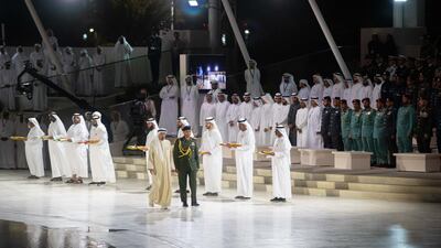 Sheikh Humaid bin Rashid Al Nuaimi, Ruler of Ajman and Supreme Council Member, in the presence of Sheikh Theyab bin Mohamed bin Zayed, Deputy Chairman of the Presidential Court for Development and Fallen Heroes' Affairs, on Commemoration Day at Wahat Al Karama