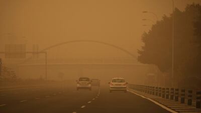 Cars drive in a cloud of red dust in Santa Cruz de Tenerife, Spain. AP Photo