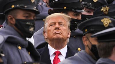 Surrounded by Army cadets, President Donald Trump watches the first half of the 121st Army-Navy Football Game in Michie Stadium at the United States Military Academy, Saturday, Dec. 12, 2020, in West Point, N.Y. (AP Photo/Andrew Harnik)