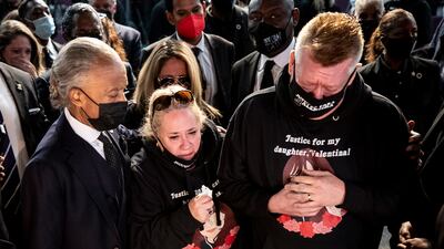 Valentina's mother Soledad Peralta (C), and her father Juan Pablo Orellana Larenas (R) react over the coffin of their daughter next to civil rights leader Reverend Al Sharpton during the funeral of Valentina Orellana Peralta at the City of Refuge Church in Gardena, California. EPA