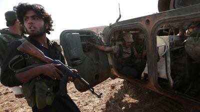 Rebel fighters ride on the outskirts of Tell Rifaat town in northern Aleppo province, which they are fighting to take from Syria Kurdish control. Khalil Ashawi / Reuters / October 22, 2016