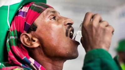 Avoid dehydration, like this labourer in Dubai, to reduce food cravings. Lee Hoagland / The National
