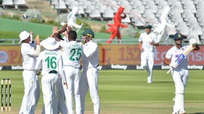 Kagiso Rabada of South Africa and team mates celebrates the wicket as India opener Mayank Agarwal asks for DRS. Getty