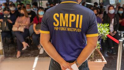 People from the Philippines prepare to cast their votes