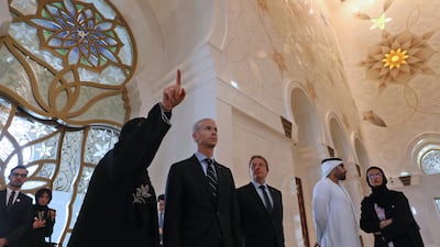 The group tour the mosque with French ambassador in the UAE Ludovic Pouille, centre.