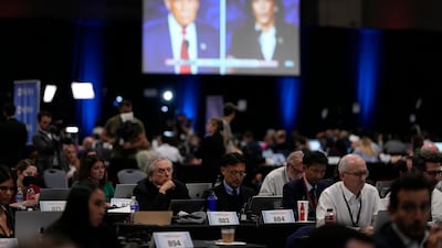 Members of the press work in the spin room during the Kamala Harris-Donald Trump presidential debate last month. AP
