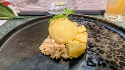 The flavour-packed four-course meal at Saffron ends with grilled pineapple and coconut sorbet. Hayley Kadrou / The National
