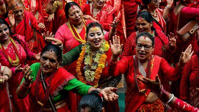 Women celebrate the Hindu festival of Teej, after offering prayers at the Pashupatinath temple in Kathmandu, Nepal. AFP