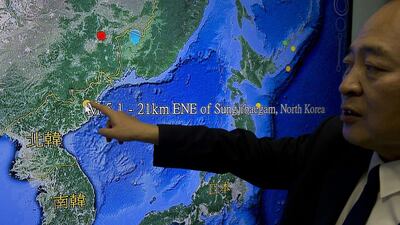 Kuo Kai-wen, director of Taiwan's Seismology Center, explains the locations from a monitor showing North Korea's first hydrogen bomb test site (AFP PHOTO / Sam Yeh)