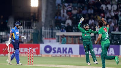 Pakistani captain and wicketkeeper Sarfaraz Ahmed, center, celebrates the dismissal of Sri Lankan batsman Danushka Gunathilaka during the second T20 in Lahore. AP