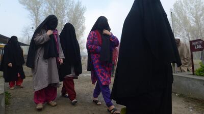 Indian voters are processed so they can cast their ballot at a local polling station during the early morning at Bijbehara. Tauseef Mustafa / AFP Photo