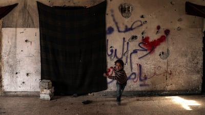 A girl runs inside an abandoned school in Hamoria, Eastern Al Ghouta, Syria, on December 23, 2017 Mohammed Badra / EPA