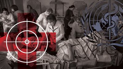 Medical workers move a patient in the basement of a maternity hospital that has been converted into a medical ward and bomb shelter in Mariupol, Ukraine, Tuesday, March 1, 2022. AP