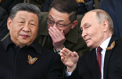 Russian President Vladimir Putin and his Chinese counterpart Xi Jinping attend a military parade. Reuters