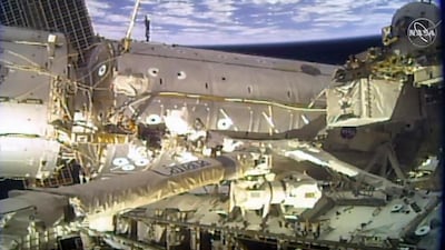 Astronauts Mike Hopkins and Victor Glover, Jr. finish a four-year effort to upgrade the International Space Station’s power system during a spacewalk on February 1, 2021. AFP