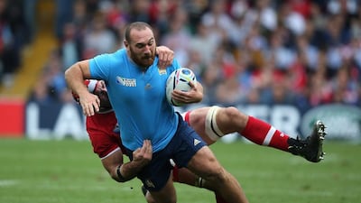 Davide Giazzon of Italy is tackled by Jamie Cudmore of Canada. Getty Images