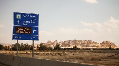 A road sign stands near the ancient heritage site at Al Ula, Saudi Arabia. Saudi Arabia's Crown Prince Mohammed Bin Salman officially launched his vision of the mega tourism project at the ancient site of Al Ula. Bloomberg