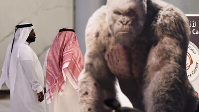 Saudi men walk at a cinema in Riyadh Park mall after its opening for the general public on April 30 in the Saudi capital. Fayez Nureldine / AFP