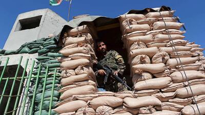 A soldier guards Jalalabad airport after the Taliban claimed to have shot down a US military transport plane that crashed in the area in October 2015. While Taliban and ISIL fight for control of areas around Jalalabad, the city itself is in thrall to powerful political clans. Noorullah Shirzada / AFP / October 2, 2015
