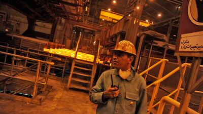 A worker stands near the production line in Khuzestan steel company on September 28, 2011 in Ahwaz, Khuzestan province, southern Iran. Getty