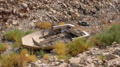 A dilapidated boat in a dried-up canal of Habbaniyah Lake in Iraq's Anbar province. AFP
