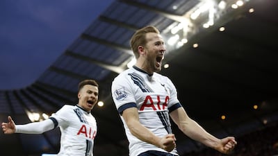 Tottenham's Harry Kane, right,celebrates after scoring the opening goal during the English Premier League soccer match between Manchester City and Tottenham Hotspur's at the Etihad Stadium in Manchester, England, Sunday Feb. 14, 2016. (AP Photo/Jon Super)