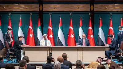 Sheikh Mohamed and Mr Erdogan watch a signing ceremony between Ms Al Mheiri and Murat Kurum, Turkish Minister of Environment and Urbanisation. Abdulla Al Neyadi / Ministry of Presidential Affairs