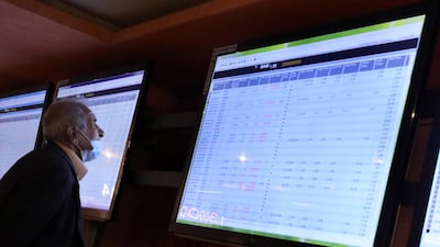 An Iraqi Investor looks at an electronic board showing shares information at the Iraqi Stock Exchange in Baghdad. EPA