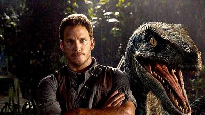 Chris Pratt and a prehistoric pal in Jurassic World. Courtesy Amblin Entertainment