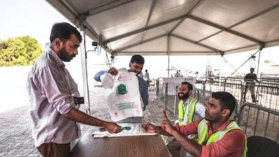A customer pays the cashier before his livestock is processed at the slaughter house.
