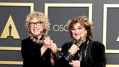 Nancy Haigh (L) and Barbara Ling pose in the press room with the Oscar for Production Design for 'Once Upon a Time in Hollywood' at the 92nd Academy Awards on Sunday, February 9. EPA