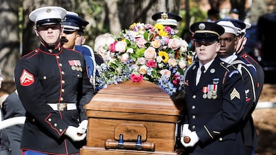A military honour guard carries the casket of the late first lady from the Jimmy Carter Presidential Library and Museum to an afternoon memorial service. EPA