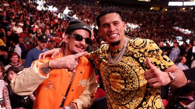 UFC fighter Sean O'Malley (L) and boxer David Benavidez attend the fight between Jake Paul and Anderson Silva. AFP
