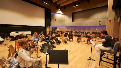 The conductor in action during the rehearsal. Photo: Firdaus Studio by A R Rahman