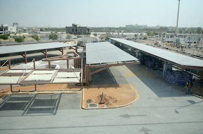 Solar panels above the car park at a building under construction at Masdar City, Abu Dhabi. Khushnum Bhandari / The National