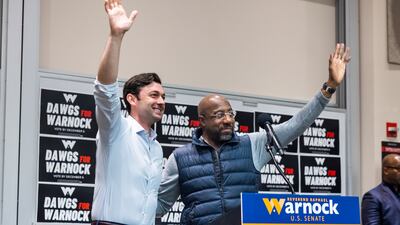 Mr Warnock alongside fellow senator from Georgia Jon Ossoff. EPA