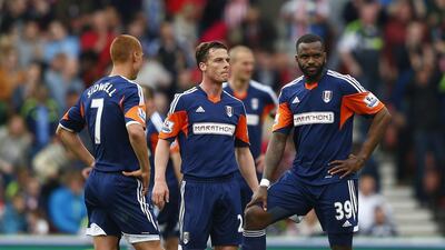 From left, Fulham players Steve Sidwell, Scott Parker and Darren Bent react during their Premier League match against Stoke City at the Britannia stadium on May 3, 2014. Eddie Keogh / Reuters