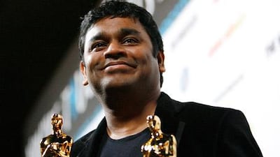 Jai ho! Rahman holds his Slumdog Millionare Oscars (Best Score and Best Original Song) at a post-award party in Los Angeles this February.