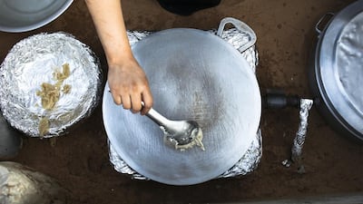Sameera Ali Mohammed prepares traditional bread. Lee Hoagland / The National