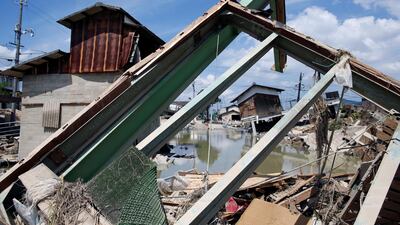 Submerged and destroyed houses in a flooded area in Kurashiki, Okayama. Reuters