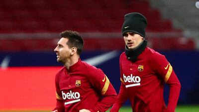 Antoine Griezmann and Lionel Messi warm up before the match between Atletico Madrid and Barcelona at the Wanda Metropolitano. Reuters