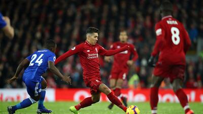Liverpool's Roberto Firmino evades a challenge the match against Leicester City at Anfield. GETTY IMAGES