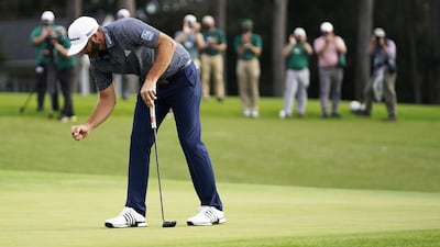 Dustin Johnson of the US reacts after sinking his putt to win on the eighteenth hole. EPA
