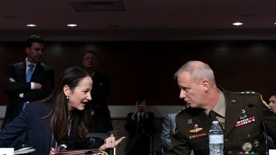 Director of National Intelligence Avril Haines speaks with DIA Director Lt Gen Scott Berrier during a Senate Armed Services hearing to examine worldwide threats. AP