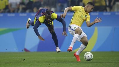 Colombia’s Helibelton Palacios, left, and Brazil’s Gabriel Jesus fight for the ball during a quarter-final match of the men’s Olympic football tournament between Brazil and Colombia at the Arena Corinthians stadium, in Sao Paulo, Brazil, Saturday, August 13, 2016. Nelson Antoine / AP Photo