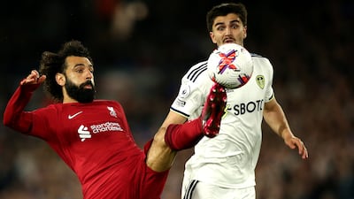 Pascal Struijk, right, of Leeds in action against Mohamed Salah of Liverpool. EPA