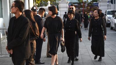 Mourners from Thailand's elite arrive at the temple. AFP