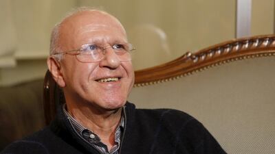 Former Lebanese information minister Michel Samaha smiles at his house in Beirut. Mohamed Azakir / Reuters